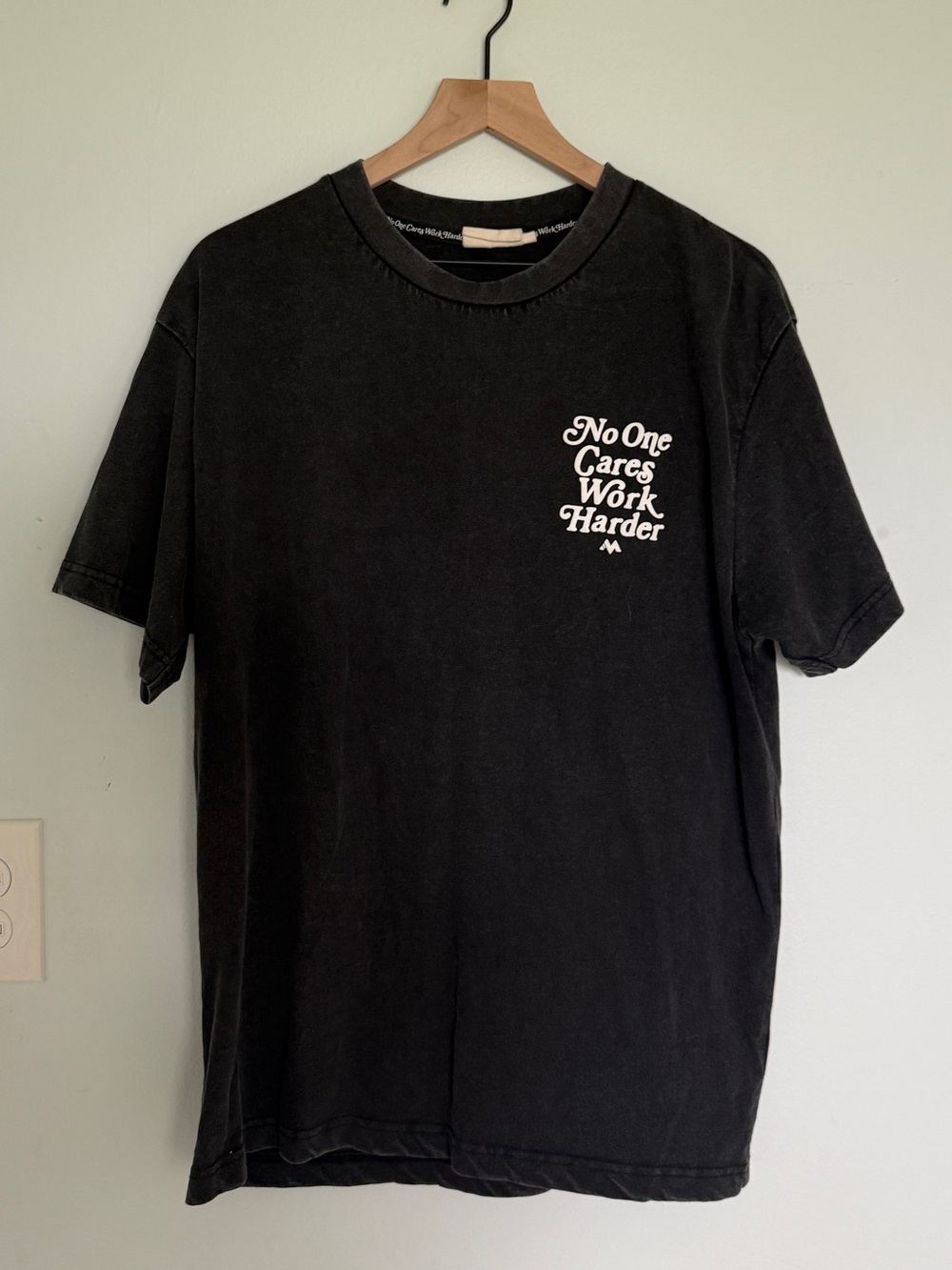 Black Short-Sleeve Graphic Tee with 'No One Cares Work Harder' Print